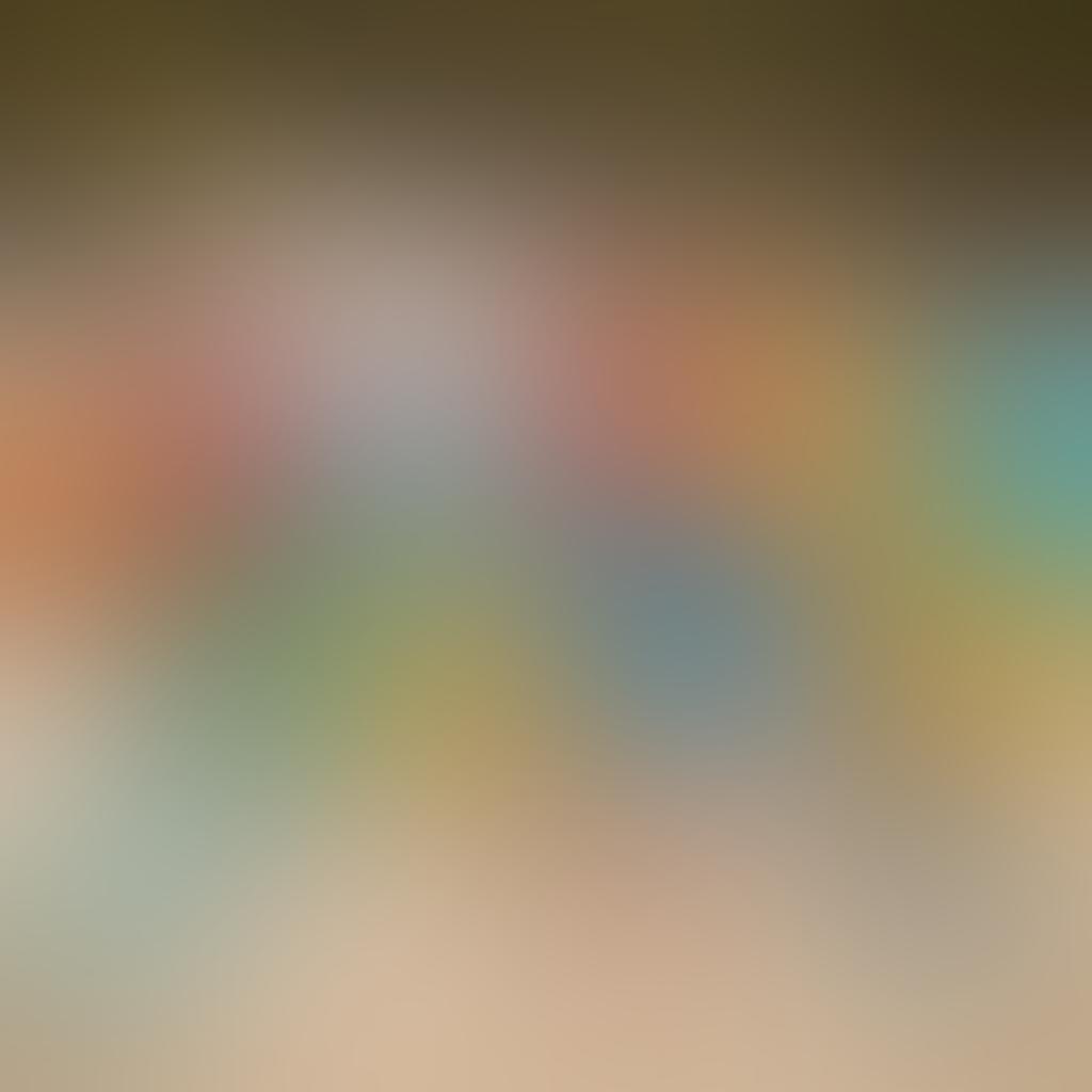 A serene beach scene showcasing a diverse group of friends enjoying the sun, each wearing stylish swimwear and activewear sourced from subscription services. Include elements like colorful beach umbrellas, surfboards, and a variety of stylish swimwear laid out on the sand, emphasizing ease and fun. Add palm trees swaying gently in the background, capturing a carefree summer vibe. vibrant colors. super-realistic. bright sunlight.